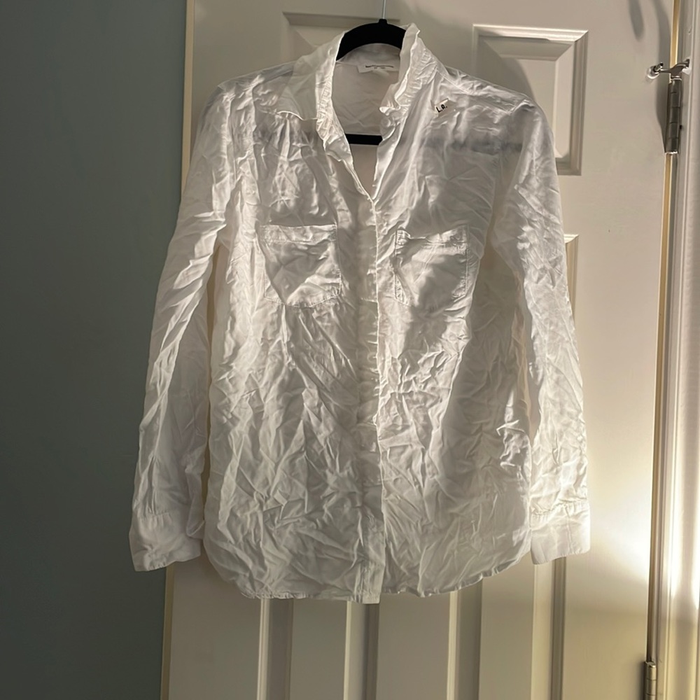 Wrinkled white button up top